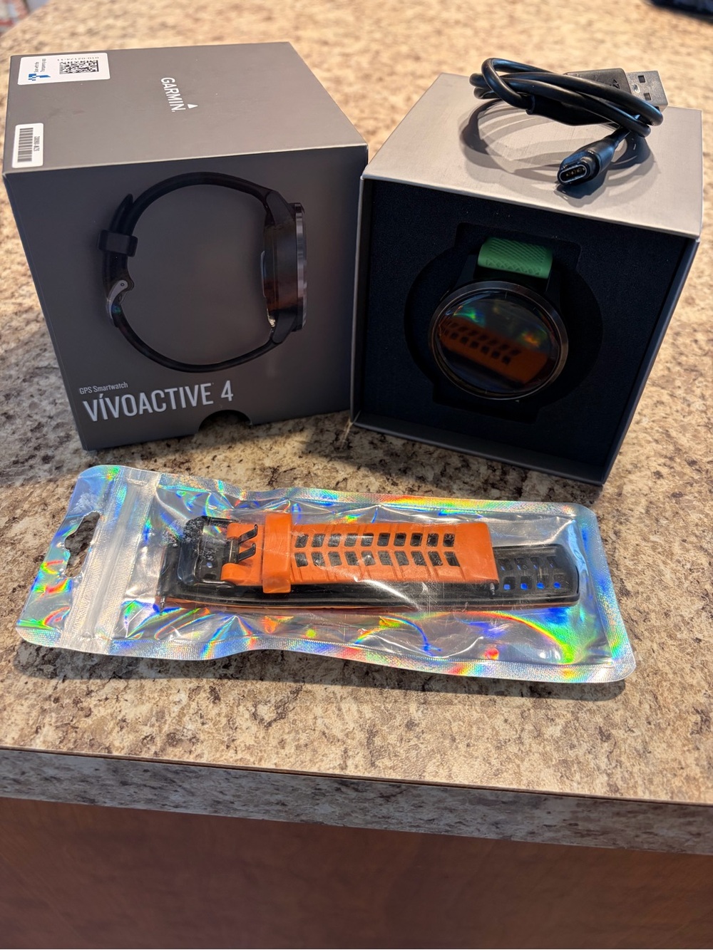 Garmin vívoactive 4 Smartwatch with Green Band + Orange/Black Replacement Strap